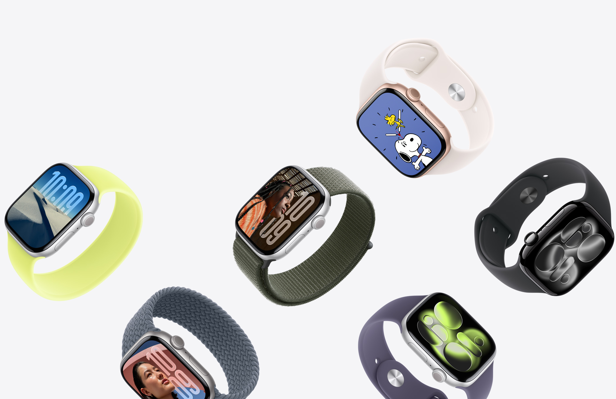 多只 Apple Watch 设备，展示不同的表壳材质、颜色和表带。